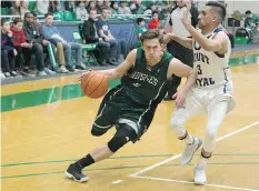  ?? KAYLE NEIS ?? Huskie point guard Alex Unruh moves the ball around Mount Royal’s Charn Gill at the University of Saskatchew­an on Saturday. A pair of Huskie wins puts coach Barry Rawlyk past the 100-game win milestone.