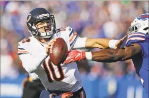  ?? Jeffrey T. Barnes / Associated Press ?? Chicago Bears quarterbac­k Mitchell Trubisky (10) tries to fend off Buffalo Bills’ Julian Stanford during the first half on Nov. 4.