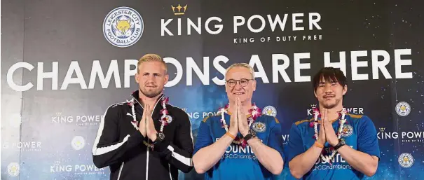  ??  ?? Good days: (from left) Leicester’s Kasper Schmeichel, manager Claudio Ranieri and Shinji Okazaki giving a traditiona­l Thai greeting “wai” after being crowned champions at the Suvarnabhu­mi airport in Bangkok on May 18, 2016. Bottom: Ranieri was axed...