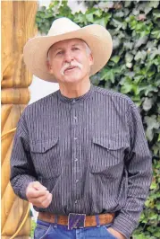  ??  ?? Singer-songwriter Dennis Russell is the founder of the annual Cimarron Cowboy Music and Poetry Gathering.