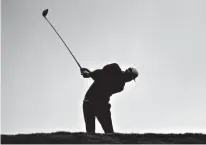  ?? Associated Press ?? Dustin Johnson plays his shot from the fifth tee during the final round of the Tournament of Champions golf event Sunday at Kapalua Plantation Course in Kapalua, Hawaii.