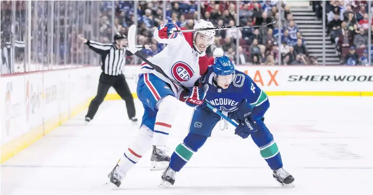  ?? — CP PHOTO ?? The Canadiens’ Kenny Agostino skates around Vancouver’s Troy Stecher during the third period of Saturday’s game in Vancouver. The Habs won, 3-2, on a late goal.