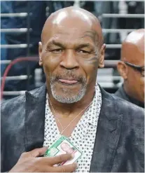  ?? AP PHOTO/ASHLEY LANDIS AND MARK J. TERRILL ?? Jake Paul speaks during a 2022 news conference in Los Angeles. Right: Former heavyweigh­t boxing champion Mike Tyson stands on the field before a 2023 NFL game between the Las Vegas Raiders and the Pittsburgh Steelers in Las Vegas.