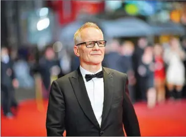  ?? VENANCE/AFP LOIC ?? General delegate of the Cannes Film Festival Thierry Fremaux waits for guest to arrive on May 25 for the screening of the film GoodTime at the 70th edition of the Cannes Film Festival in Cannes, southern France.