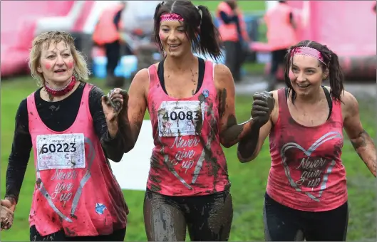  ?? Pictures: Stewart Attwood ?? Thousands of women tackled the obstacle course at Bellahoust­on Park to raise funds for Cancer Research UK