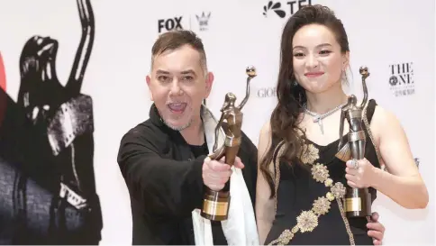  ??  ?? Anthony Wong and Chloe Maayan celebrate their best actor and actress awards.