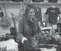  ??  ?? Store manager Tori Conlin accepts clothing for possible consignmen­t at Your Closet Or Mine.