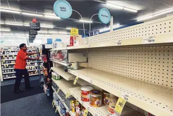  ?? Chris Granger / Associated Press ?? Shelves are empty where baby formula is normally located at a CVS pharmacy in New Orleans. The shortage stems from a recall by Abbott Nutrition after reports of bacterial infections.