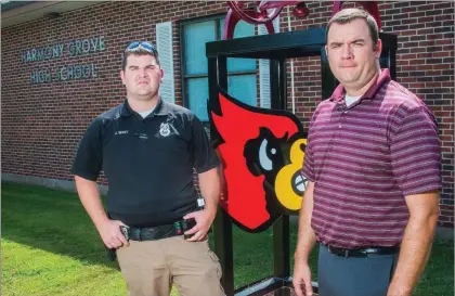  ?? WILLIAM HARVEY/TRILAKES EDITION ?? Joseph West, left, the new school resource officer for the Harmony Grove School District, stands next to superinten­dent Heath Bennett in front of the high school. West is the first resource officer in the school’s history.