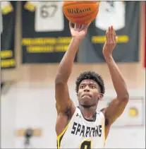  ?? VINCENT D. JOHNSON/DAILY SOUTHTOWN ?? Marian Catholic’s Joe Green shoots a free throw during the fourth quarter of Friday night’s game against Benet in Chicago Heights.