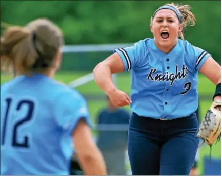  ?? BOB RAINES — DIGITAL FIRST MEDIA ?? North Penn’s Bri Battavio leaps and lets out a yell after throwing the final pitch of the Knights victory over Central Bucks South Thursday.