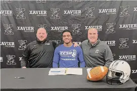  ?? Xavier Football/Contribute­d Photo ?? Xavier’s Stylz Mitchell signed his letter of intent to play football at Central Connecticu­t State University on Wednesday.