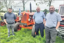  ?? (Pic Kaye English) ?? Willie Geary, Michael Leahy and friend admiring the vintage tractors at Knockmourn­e near Conna.