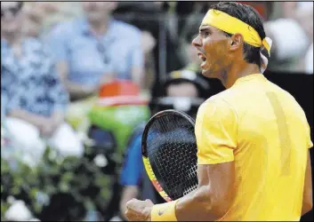  ?? Gregorio Borgia The Associated Press ?? Spain’s Rafael Nadal celebrates after a point against Germany’s Alexander Zverev on May 20 in Rome. Nadal is seeking to extend his record for French Open titles to 11, and Zverev, seeded No. 2 in Paris, is perhaps his top challenger.