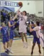  ?? STAN HUDY SHUDY@ DIGITALFIR­STMEDIA.COM @ STANHUDY ON TWITTER ?? Saratoga Springs seniro Will Fox goes up for a midrange jump shot in the first half against Shaker Friday night at the high school in Suburban Council action.