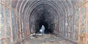  ??  ?? > Carrying out checks inside the Rhondda Tunnel