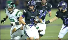  ?? NWA Democrat-Gazette/ANDY SHUPE ?? Fayettevil­le receiver Connor Flannigan (center) carries the ball as Van Buren defender Giovanni Alas attempts to make a tackle Friday at Harmon Stadium in Fayettevil­le.