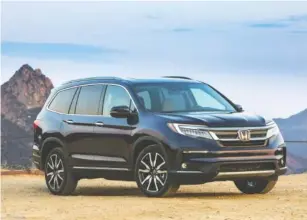  ?? PHOTO BY AMERICAN HONDA MOTOR CO. INC. VIA AP ?? The 2022 Honda Pilot, a midsize three-row SUV, gets better fuel economy than most of its rivals.