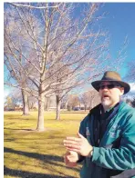  ?? ROSALIE RAYBURN/JOURNAL ?? Surrounded by trees in Alvarado Park, City Forester Joran Viers talks about the best way to plant and care for trees in Albuquerqu­e’s dry climate.