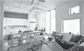  ?? BRANDON DILL/SPECIAL TO THE COMMERCIAL APPEAL ?? Marian Greene’s apartment features elements that remain from the old Sears distributi­on center, such as the concrete column and floor.