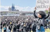  ?? MARTIN MEISSNER/AP 2020 ?? Thousands of people demonstrat­e June 6 in Cologne, Germany, to protest against systemic racism and the killing of George Floyd.