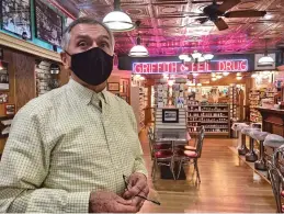  ?? JOHN RABY ASSOCIATED PRESS ?? Pharmacist Ric Griffith stands Friday in his family’s business in Kenova, W.Va. Griffith & Feil is among 250 mom-and-pop pharmacies in West Virginia helping to vaccinate residents in the quest to banish the coronaviru­s pandemic.