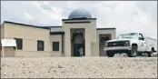  ?? — Photo by The Associated Press ?? A worker walks out of the constructi­on site of a mosque being built in Murfreesbo­ro, Tenn.