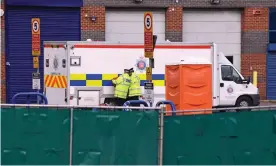  ??  ?? The bodies of 39 people being transporte­d under police escort by private ambulance from the Port of Tilbury to Broomfield Hospital in Chelmsford last Friday. Photograph: Kirsty O’Connor/PA