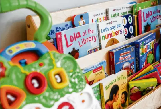  ?? CHRISTIANA BOTIC FOR THE BOSTON GLOBE ?? Books, toys and educationa­l materials line the walls of Brown Bear Excel Early Learning Center, a home-based day-care center in Hyde Park.