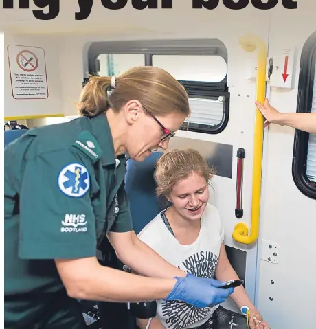  ??  ?? Lynsey Raitt (right) and Susan McLeod treat a patient in their roles as paramedics which sees them face a raft