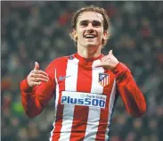  ?? REUTERS ?? Antoine Griezmann celebrates scoring for Atletico Madrid in its 4-2 Champions League win at Bayer Leverkusen.