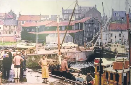  ??  ?? A picture from a bygone age shows a busy scene at St Monans harbour.