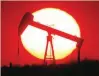  ?? — Reuters ?? The sun sets behind an oil pump outside Saint-fiacre, near Paris, France.