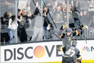  ?? AP PHOTO ?? In this Friday, May 18, 2018, file photo, Vegas Golden Knights right wing Reilly Smith, back, celebrates his goal with Luca Sbisa during the third period against the Winnipeg Jets in Game 4 of the NHL hockey Western Conference finals in Las Vegas.