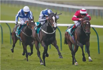  ??  ?? Jim (centre) drives out a winning finish on Eminent in the Craven Stakes earlier this year