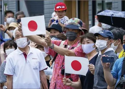  ?? FRANK GUNN — THE CANADIAN PRESS VIA AP, FILE ?? In this July 24, 2021, file photo, spectators line the course of the men’s cycling road race at the 2020Summer Olympics in Tokyo. How are we to judge the pandemic-delayed Tokyo Olympics when they wrap up in two weeks? It’s a straightfo­rward question but it’s difficult to answer. That’s because there are many interests involved.