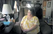  ?? JUSTIN MERRIMAN / AP PHOTO ?? Doris Kelley, 57, sits in her home on Monday, June 29 in Ruffs Dale, Pa. Kelley was one of the first patients in a UPMC trial for COVID-19. “It felt like someone was sitting on my chest and I couldn’t get any air,” Kelley said of the disease.