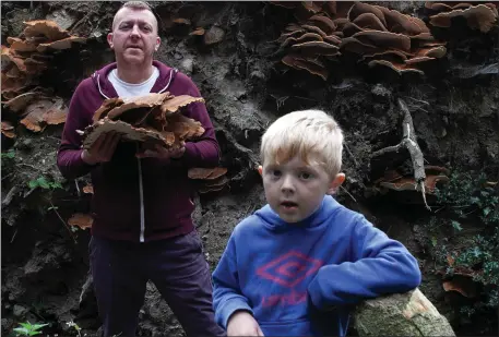  ??  ?? Barry Reid pictured with his son Brehon with a foraged meripilus giganteus mushroom.