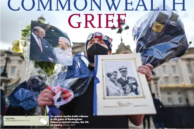  ?? Photo: AFP ?? An ardent royalist holds tributes at the gates of Buckingham Palace in central London, the UK, on April 9.