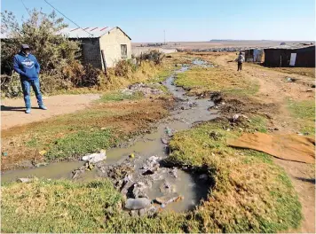  ?? | BHEKIKHAYA MABASO African News Agency (ANA) ?? RAW sewage runs down in the street of Harrismith, Free State, as the sewage treatment plant has not been working for more than a year now, resulting in service delivery protests earlier this month.