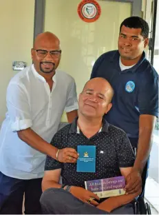  ??  ?? Fiji Human Rights and Anti-Discrimina­tion Commission director Ashwin Raj (standing, left), Fiji Disabled People’s Federation president Joshco Wakaniyasi (seated).