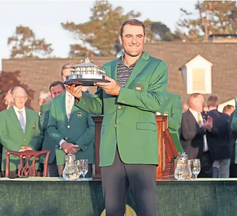  ?? ?? DOING WELL: Masters champion Scottie Scheffler celebrates with the trophy after winning in Augusta, Georgia.