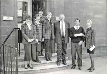  ?? 01_B11twe02 ?? Staff from the Royal Bank present Arran High maths teacher Jimmy Stewart with travel vouchers worth £500. Jim was one of four people nationwide to win a prize in a Royal Bank competitio­n.