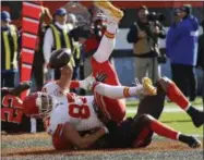  ?? RON SCHWANE — THE ASSOCIATED PRESS ?? Chiefs tight end Travis Kelce is tackled by Christian Kirksey after scoring on an 11-yard pass Nov. 4.