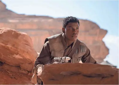  ?? JONATHAN OLLEY/LUCASFILM ?? John Boyega reprises his role as Stormtroop­er-turned-hero Finn for the third time in the trilogy closer “Star Wars: The Rise of Skywalker.”