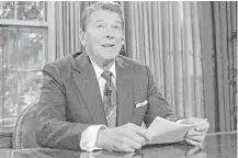  ?? Scott Stewart / Associated Press file ?? Many consider President Ronald Reagan’s signature triumph the Tax Reform Act of 1986, a compromise forged with a Democratic House. Top tax rates came down, the code was simplified, and the stock market jumped.