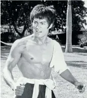  ?? Picture: GETTY IMAGES/ GEORGE RINHART ?? FURY UNLEASHED: Bruce Lee in an outdoor scene from ‘Fists of Fury’, 1972.