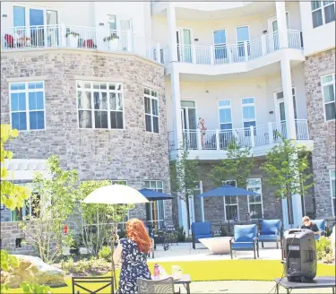  ?? COURTESY OF SAGELIFE ?? Echo Lake residents took to the balconies and patio for a round of outdoor bingo in Malvern, Chester County, in June.