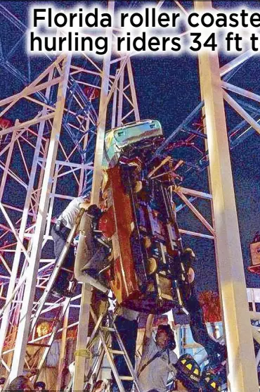  ??  ?? Photo shows one of the carriages left dangling from the roller coaster at Daytona Beach Boardwalk.