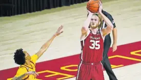  ?? [AP PHOTO/ CHARLIE NEIBERGALL] ?? Oklahoma forward Brady Manek (35) shoots during the first half of a 66-56 win at Iowa State on Saturday.